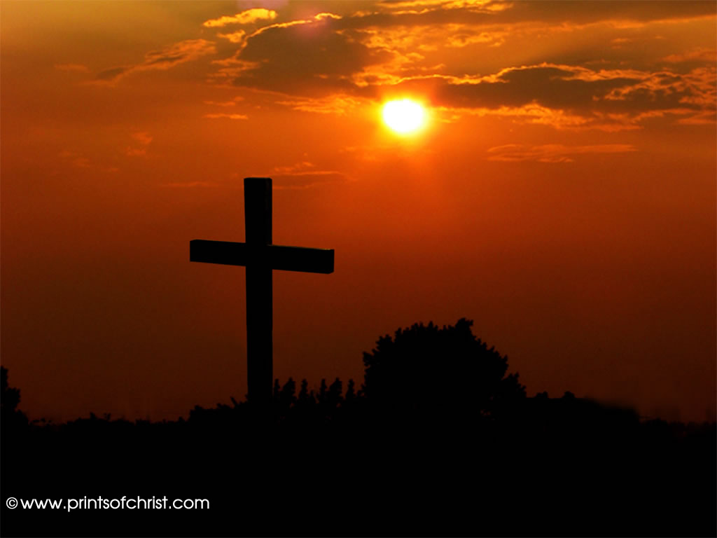 crucifix at sunset background