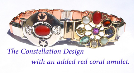 constellation design with added red coral amulet