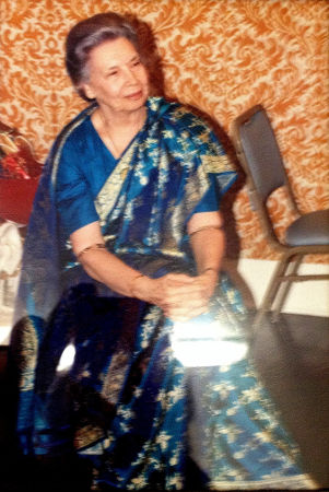 Ananda Mata wearing a three metal bangle and an astrological bangle