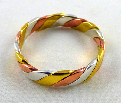Another one of our tri-metal rings, the Flattened Rope Twist.